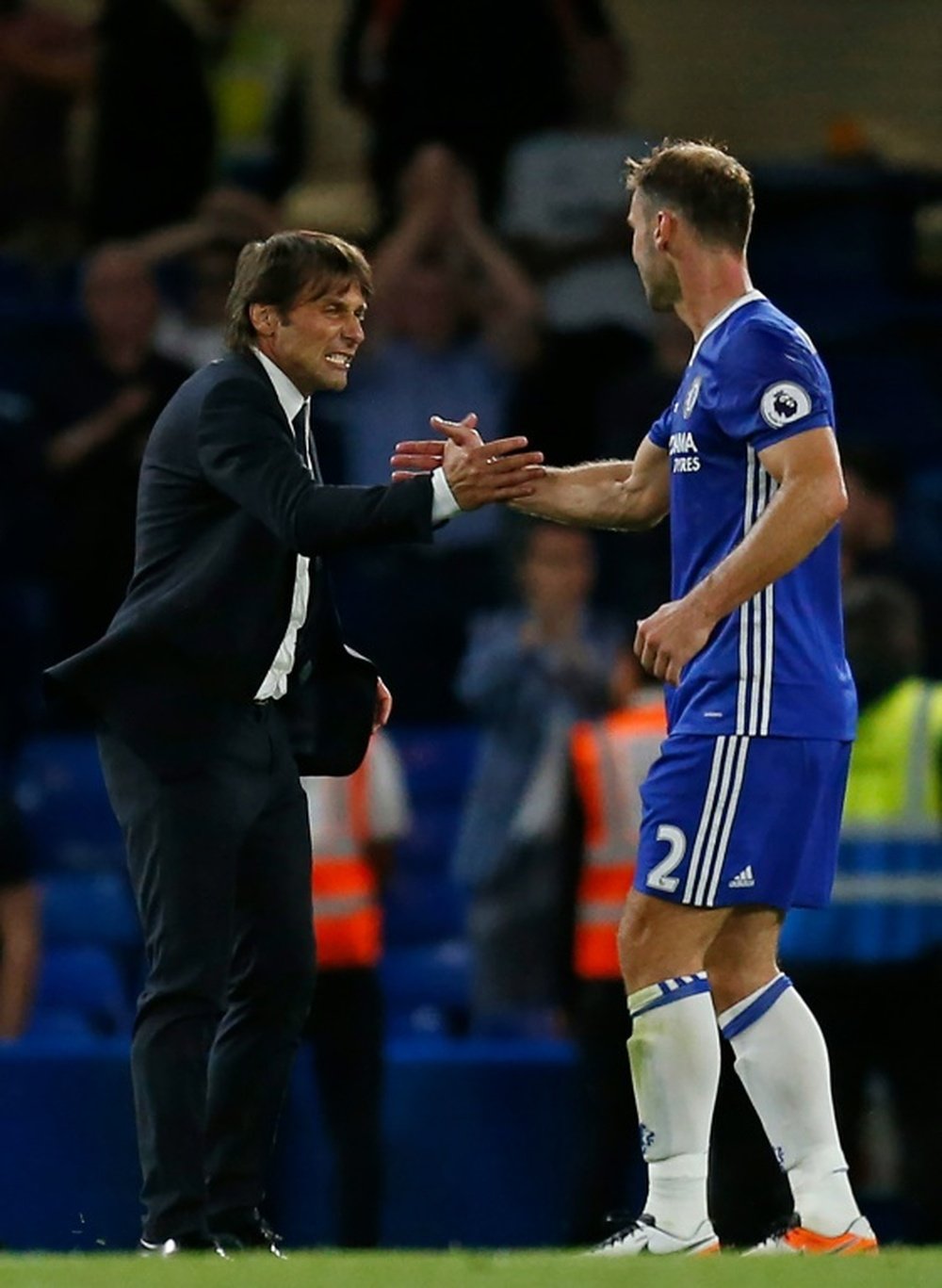 Ivanovic (R) believes that Chelsea didn't deliver for Conte. AFP