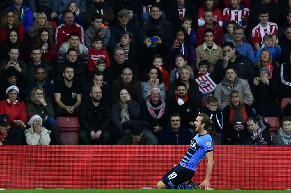 Tottenham Hotspurs striker Harry Kane celebrates after scoring a goal during the English Premier League football match between Southampton and Tottenham Hotspur at St Marys Stadium in Southampton, southern England on December 19, 2015