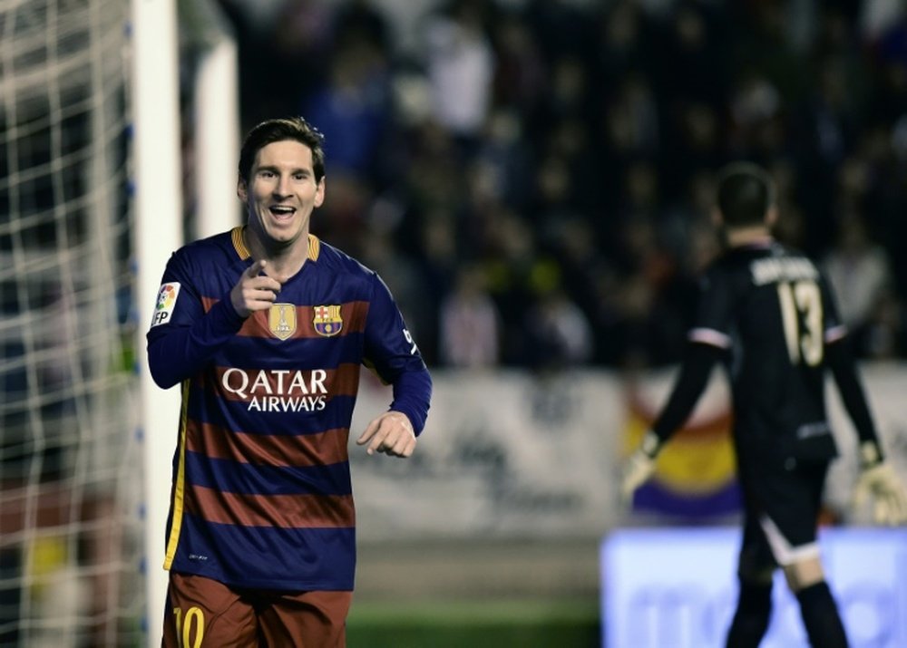 Barcelonas forward Lionel Messi celebrates after scoring during a Spanish league football match against Rayo Vallecano in Madrid on March 3, 2016.