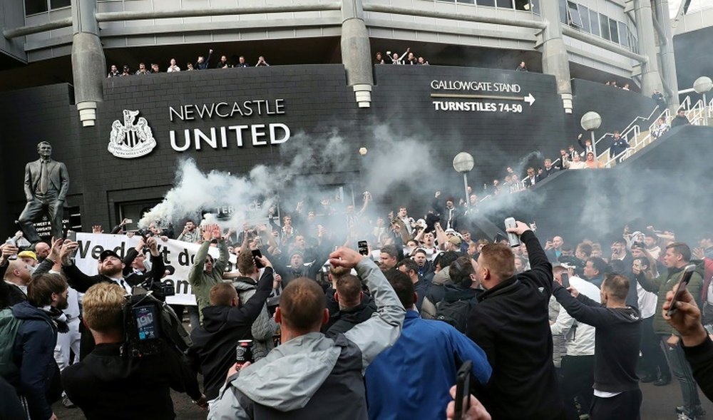 Fan treated at St. James' Park, stable in hospital. AFP
