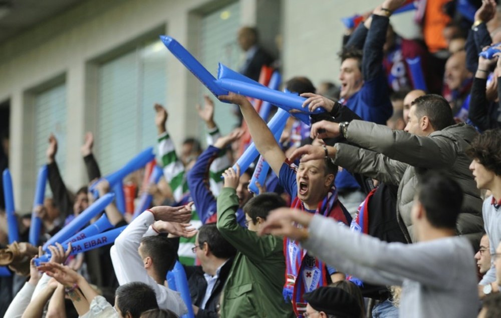 Eibar fans celebrate during a match at the Ipurua stadium in Eibar on May 31, 2014
