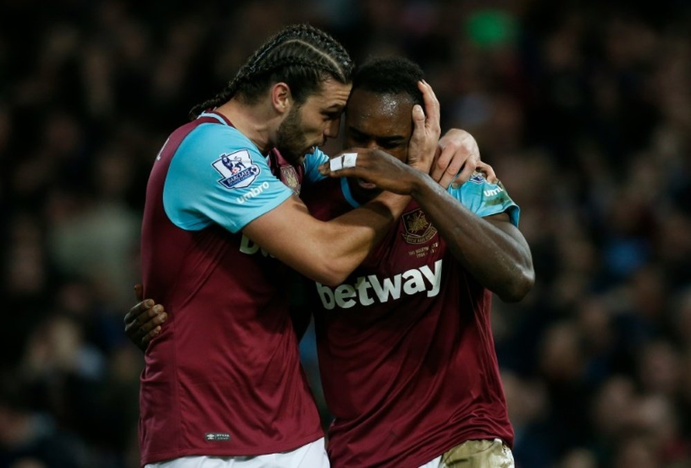 West Ham Uniteds midfielder Michail Antonio celebrates with striker Andy Carroll (L) after scoring their first goal during the English Premier League football match against Southampton in Upton Park, in east London on December 28, 2015