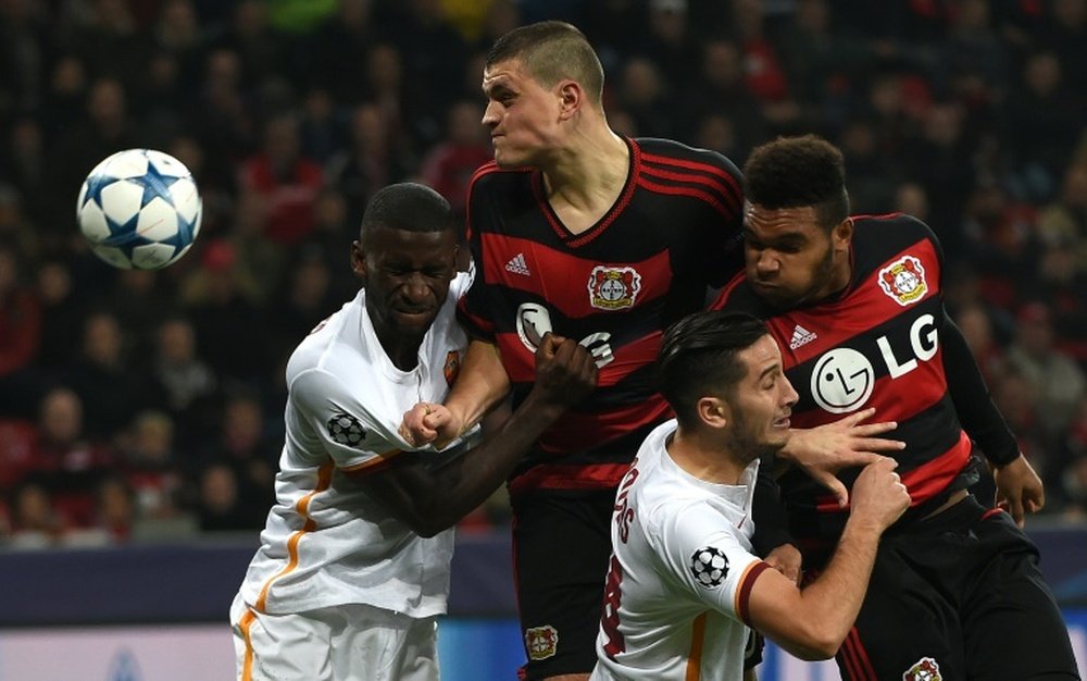 Leverkusens Kyriakos Papadopoulos and Jonathan Glao Tah (R) vie with Roma´s Antonio Ruediger (L) and Kostas Manolas during the Group E, first-leg UEFA Champions League football match in Leverkusen, western Germany on October 20, 2015
