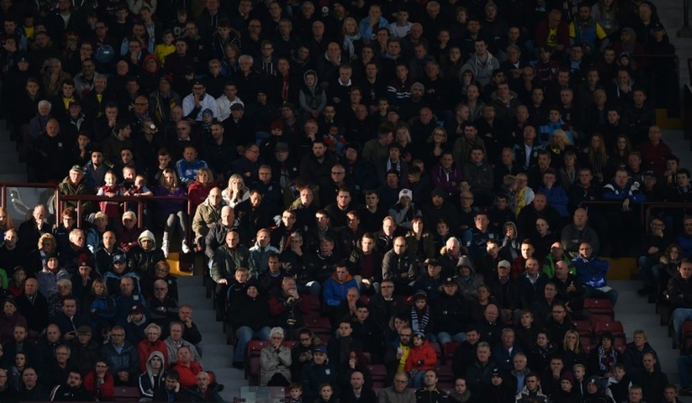 Aston Villa supporters watch a match between Aston Villa and Swansea City in England on October 24, 2015