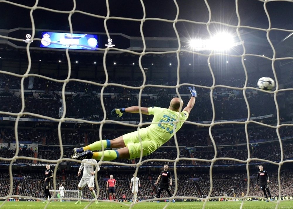 The ball flies past Napoli goalkeeper Pepe Reina after Casemiro's strike. AFP