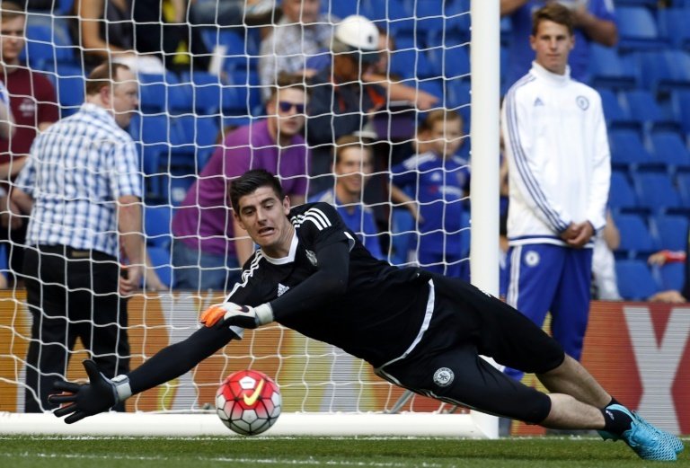 Chelseas Belgian goalkeeper Thibaut Courtois warms up during the English Premier League football match between Chelsea and Swansea City at Stamford Bridge in London on August 8, 2015RESTRICTED TO EDITORIAL USE. No use with unauthorized audio, video, data, fixture lists, club/league logos or live services. Online in-match use limited to 75 images, no video emulation. No use in betting, games or single club/league/player publications.