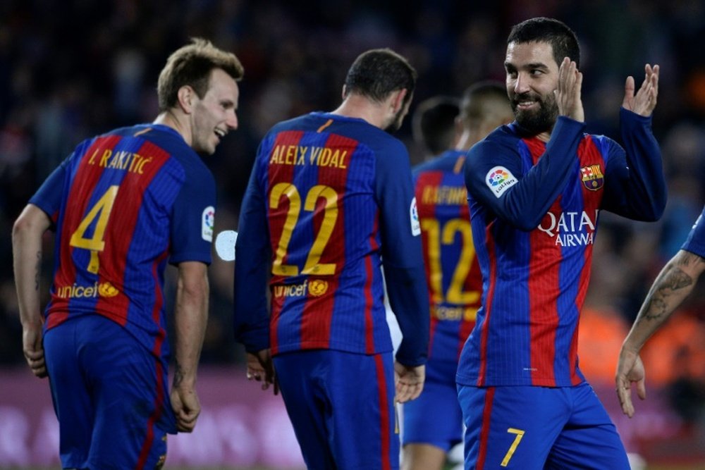 Barcelonas Turkish midfielder Arda Turan (R) celebrates after scoring during the Spanish Copa del Rey (Kings Cup) round of 32 second leg football match FC Barcelona vs Hercules CF at the Camp Nou stadium in Barcelona on December 21, 2016