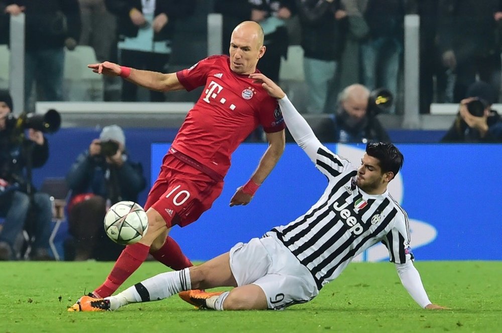 Bayern Munich midfielder Arjen Robben (L) is tackled by Juventus forward Alvaro Morata during the Champions League round of 16 first leg at the Juventus Stadium in Turin on February 23, 2016