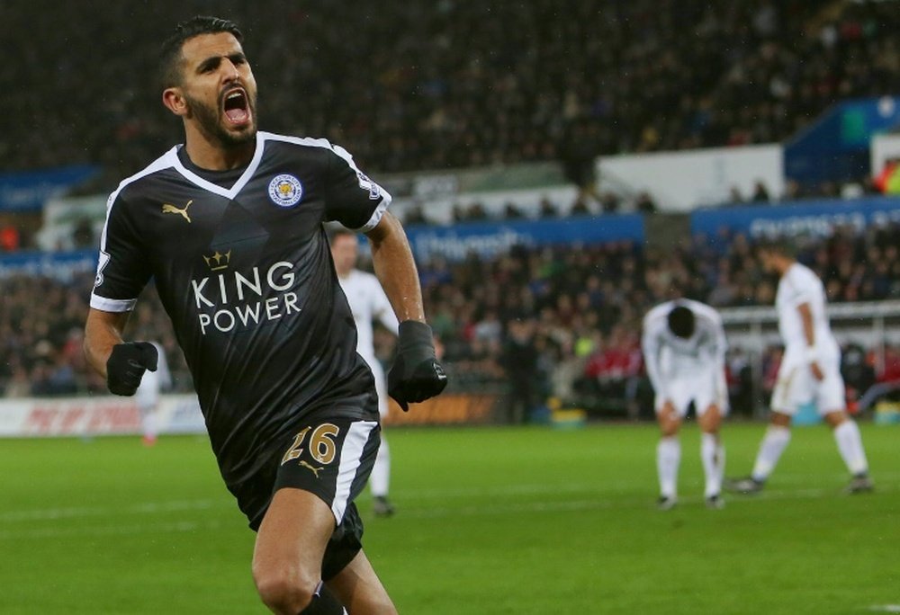 Leicester Citys Algerian midfielder Riyad Mahrez celebrates after scoring his third goal during a match against Swansea City Stadium in Swansea, south Wales on December 5, 2015