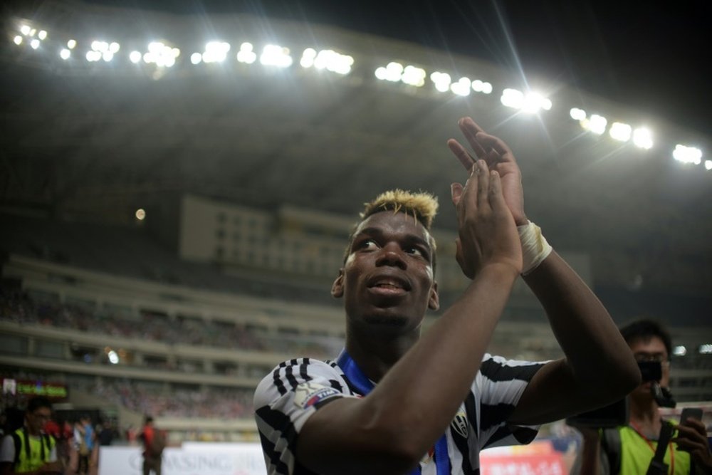 Juventus midfielder Paul Pogba celebrates his teams victory after the Italian Super Cup final against Lazio in Shanghai on August 8, 2015