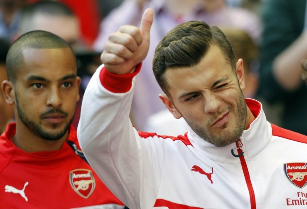 Arsenal midfielder Jack Wilshere (right) faces a long spell on the sidelines