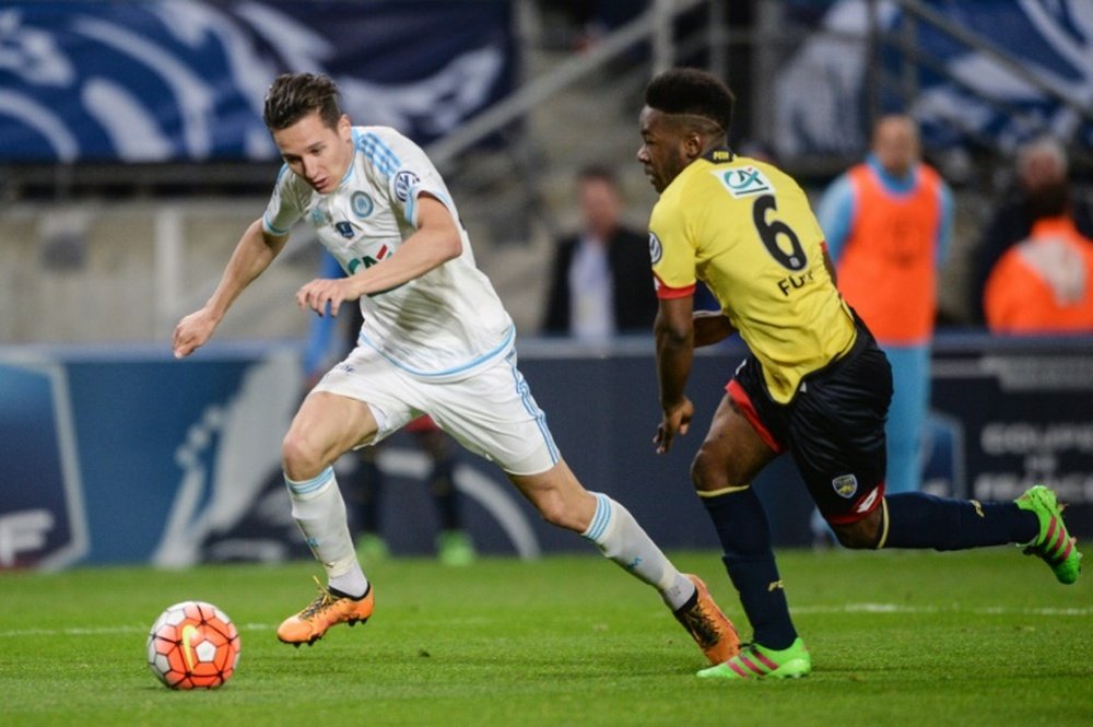 Marseille midfielder Florian Thauvin (L) vies with Sochaux defender Jeando Fuchs during the French Cup semi-final match in Montbeliard on April 20, 2016