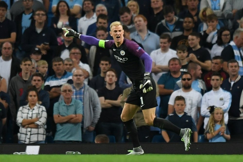 Manchester Citys English goalkeeper Joe Hart gestures during the UEFA Champions league second leg play-off football match between Manchester City and Steaua Bucharest at the Etihad Stadium in Manchester, north west England on August 24, 2016