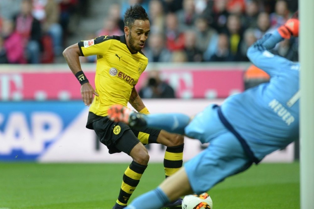 Dortmunds striker Pierre-Emerick Aubameyang (L) scores against Bayern Munich on October 4, 2015