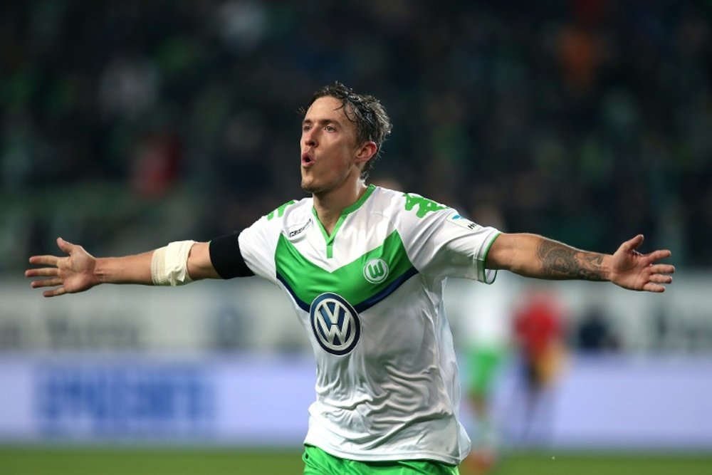 Wolfsburg's striker Max Kruse celebrates after scoring. BeSoccer