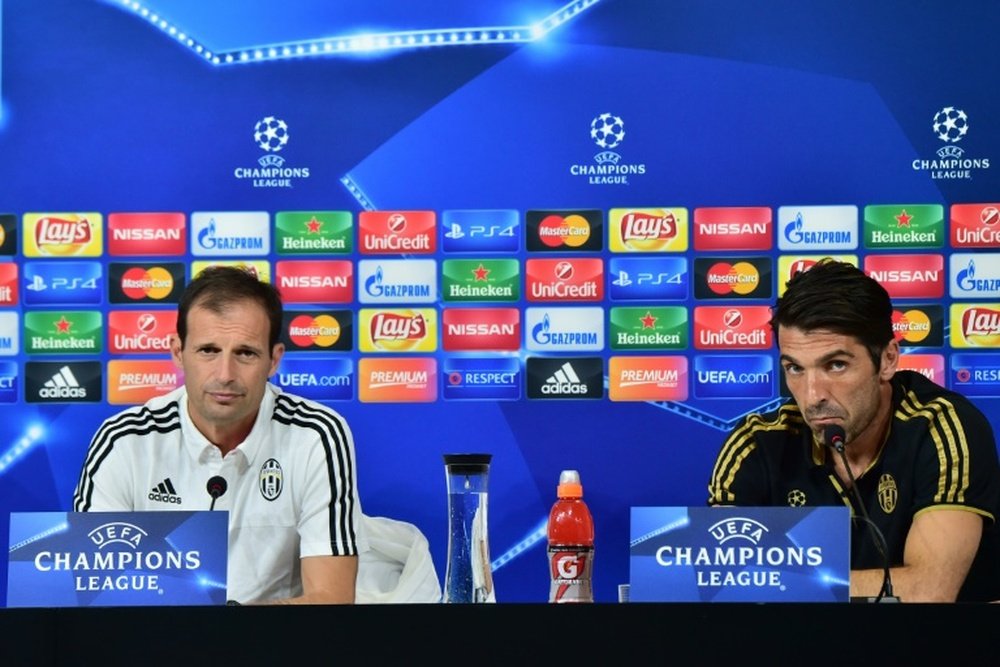 Juventus coach Massimiliano Allegri (L) and Juventus goalkeeper Gianluigi Buffon attend a press conference on the eve of the Champions League football match Juventus vs Sevilla FC at the Juventus Stadium on September 29, 2015 in Turin