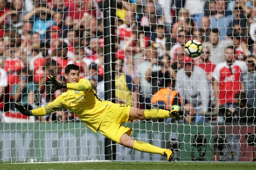 Courtois is beaten by a penalty during the shoot-out at Wembley. AFP