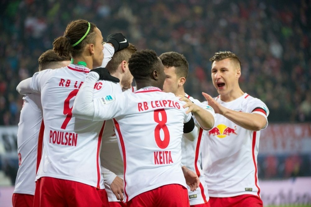 Players of RB Leipzig celebrate after scoring a goal during their German first division Bundesliga match against Schalke 04, in Leipzig, on December 3, 2016