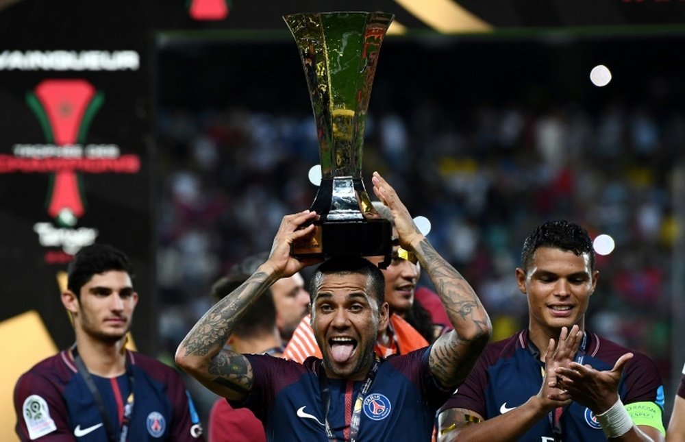Dani Alves has 36 trophies in his ever-expanding collection. AFP