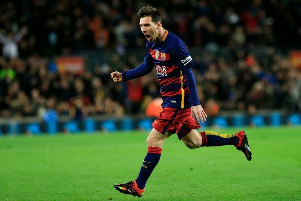 Barcelonas forward Lionel Messi celebrates after scoring during the Spanish Copa del Rey round of 16 first leg football match FC Barcelona vs RCD Espanyol at the Camp Nou stadium in Barcelona on January 6, 2016