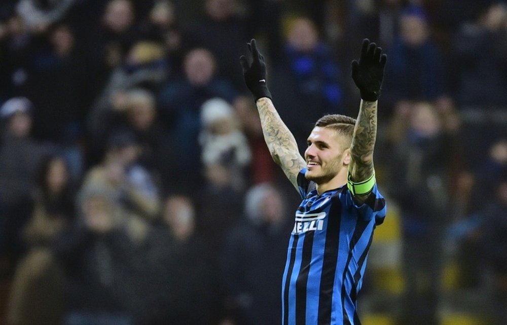 Inter Milans forward Mauro Icardi celebrates after scoring a goal during an Italian Serie A football match against Palermo at the San Siro Stadium in Milan on March 6, 2016