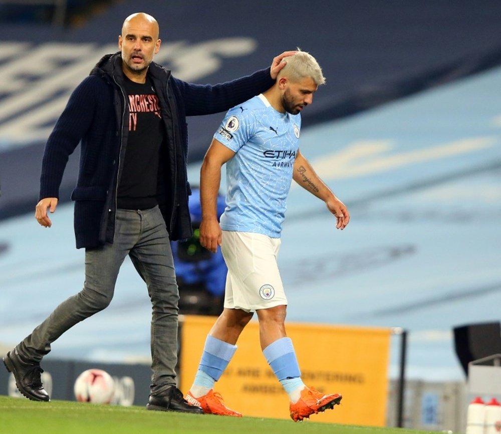 Sergio Aguero (R) and his manager Pep Guardiola. AFP