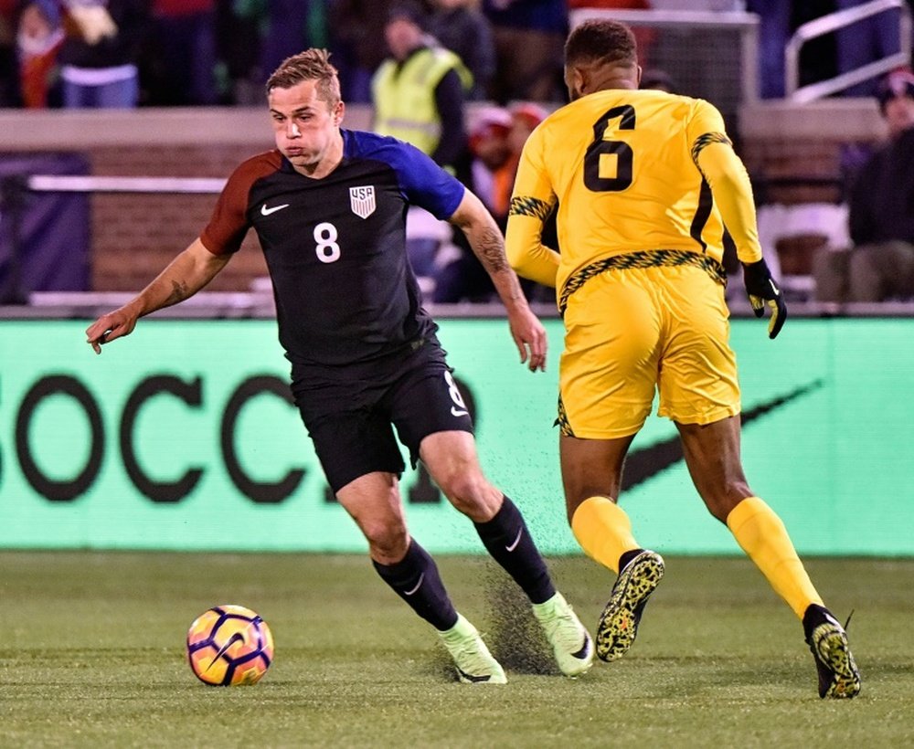 Jordan Morris (L) of the US fights for the ball with Sergio Campbell of Jamaica. AFP