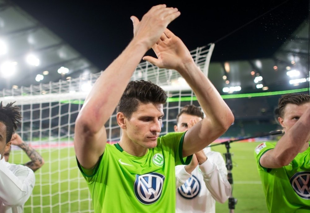 Wolfsburgs forward Mario Gomez celebrates after the Bundesliga Relegation first-leg football match