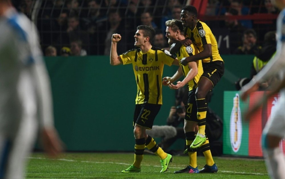 Dortmund set up semi-final against Bayern.