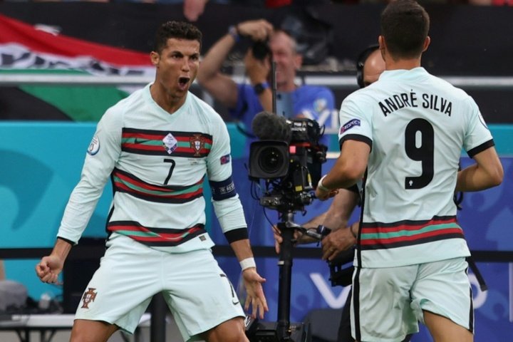 Ronaldo makes history as Portugal leave it late to shine