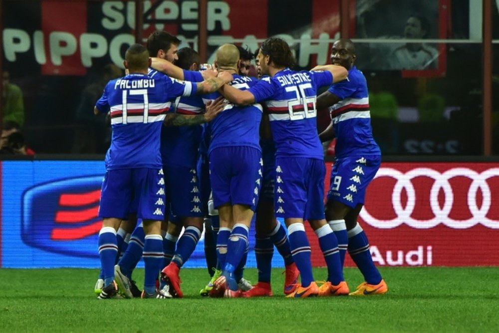 Sampdorias midfielder Roberto Soriano celebrates with teammates after scoring during a football match in Milan on April 12, 2015