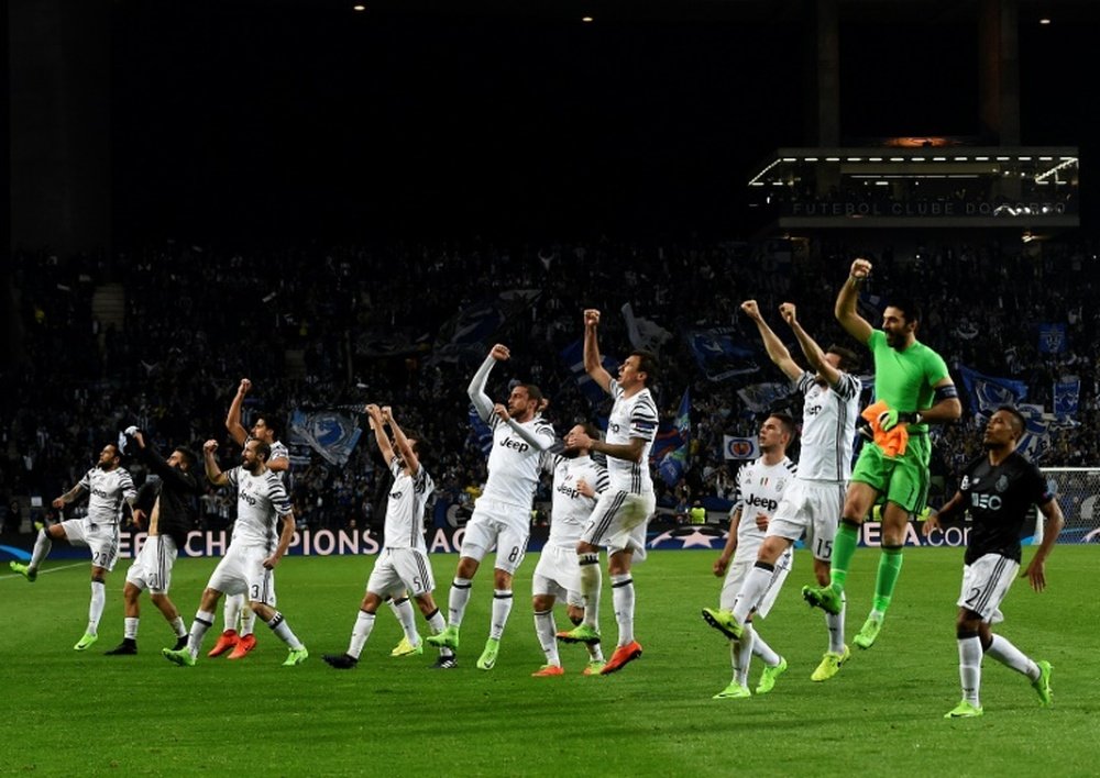 Juventus players celebrate their 2-0 victory against Porto