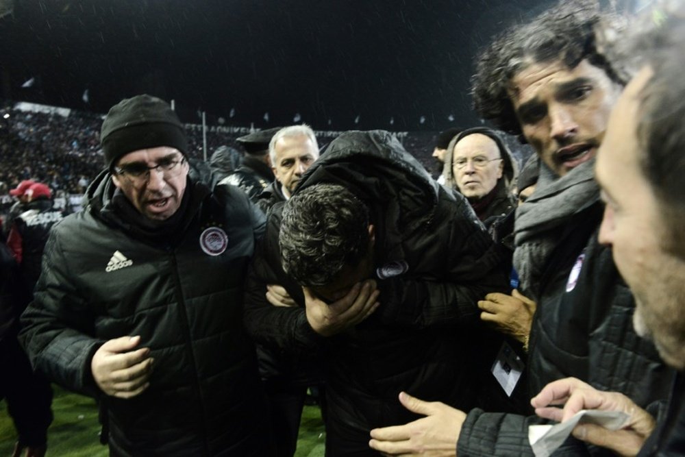 Minister brands arrested PAOK fan 'idiot' over thrown paper roll. AFP