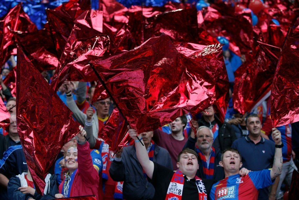 Crystal Palaces fans waves flags in the stands on May 21, 2016