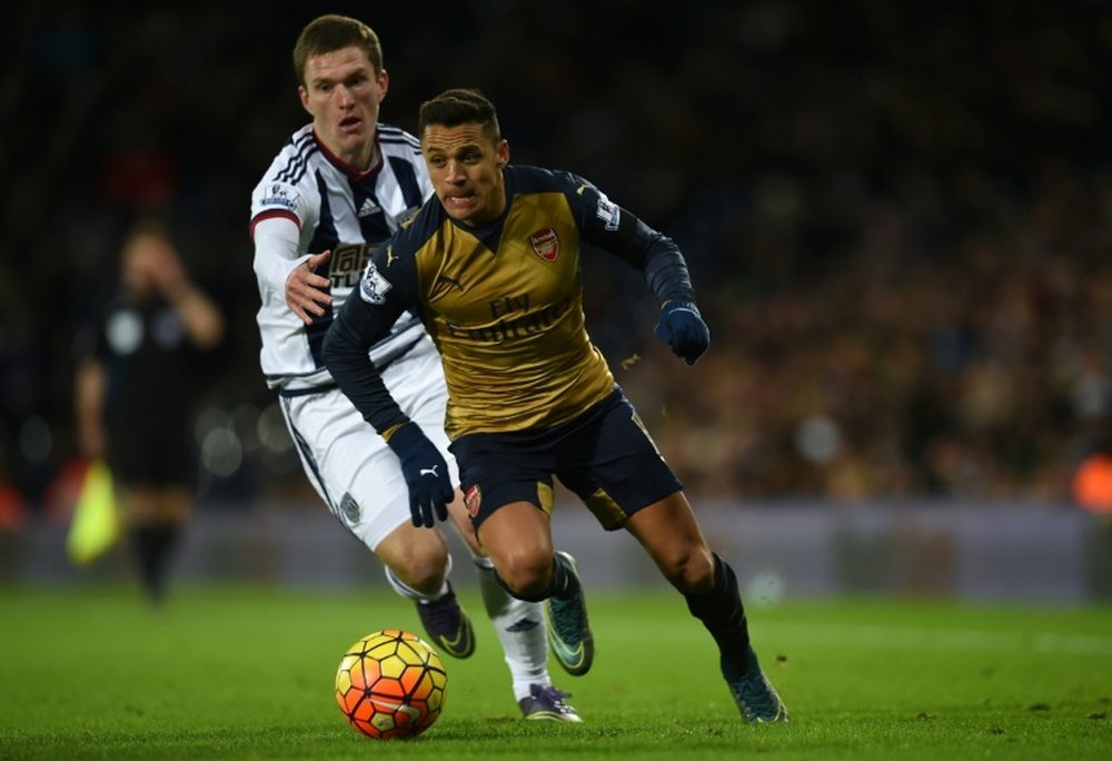 West Bromwich Albions Craig Gardner challenges Arsenals Alexis Sanchez during the match at The Hawthorns in West Bromwich, England on November 21, 2015