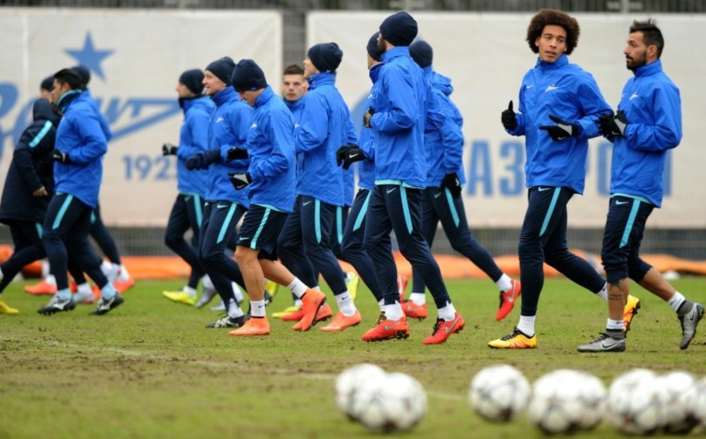 Zenit St Petersburgs players run during a training session in St. Petersburg, on the eve of a UEFA Champions League match, on March 8, 2016