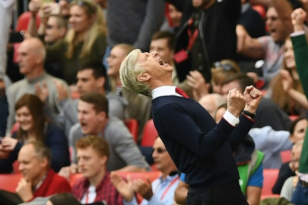 Arsenals manager Arsene Wenger celebrates victory against Manchester City