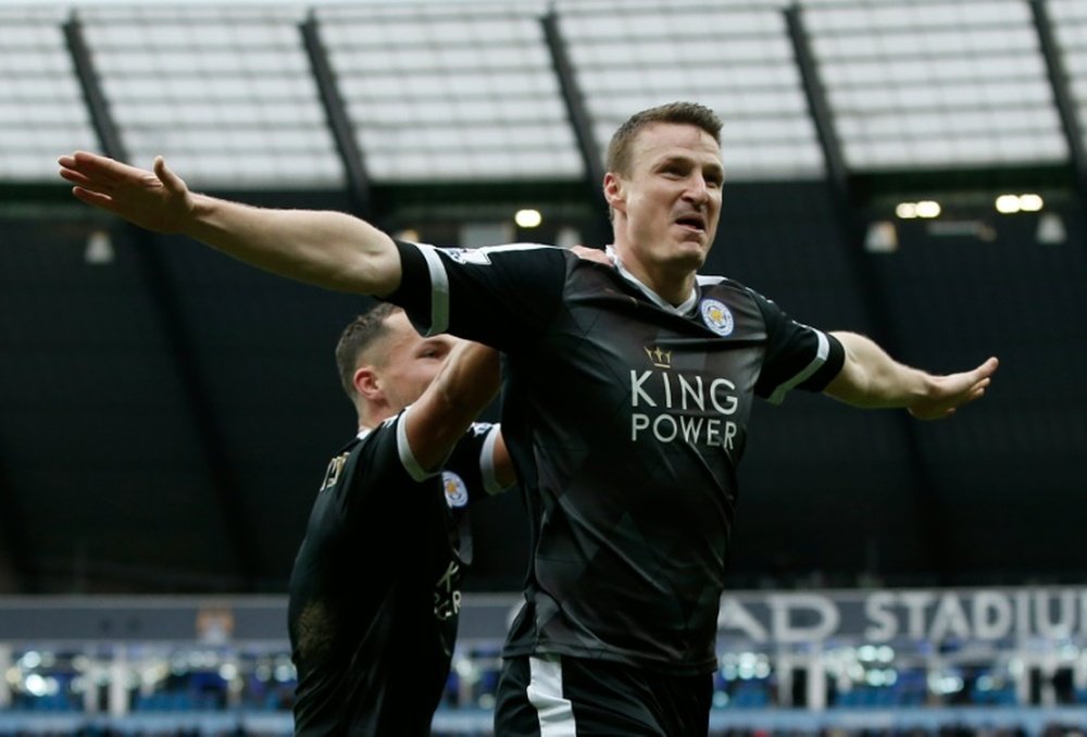 Leicester Citys defender Robert Huth celebrates scoring his teams third goal during the English Premier League football match between Manchester City and Leicester City at the Etihad Stadium in Manchester, England, on February 6, 2016