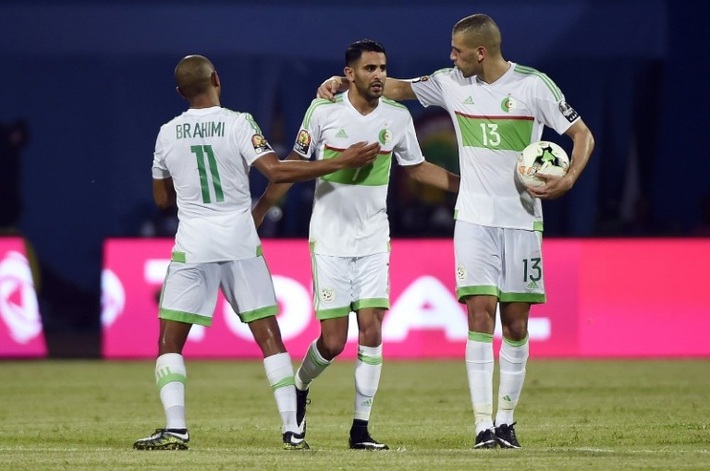 Algeria's Riyad Mahrez (C) celebrates with Yacine Brahimi (R) and Islam Slimani. AFP