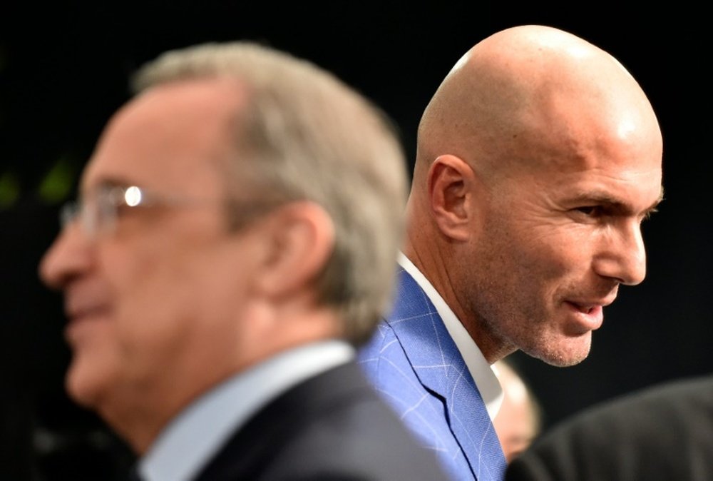 Real Madrids new French coach Zinedine Zidane (right) pictured at the Santiago Bernabeu stadium