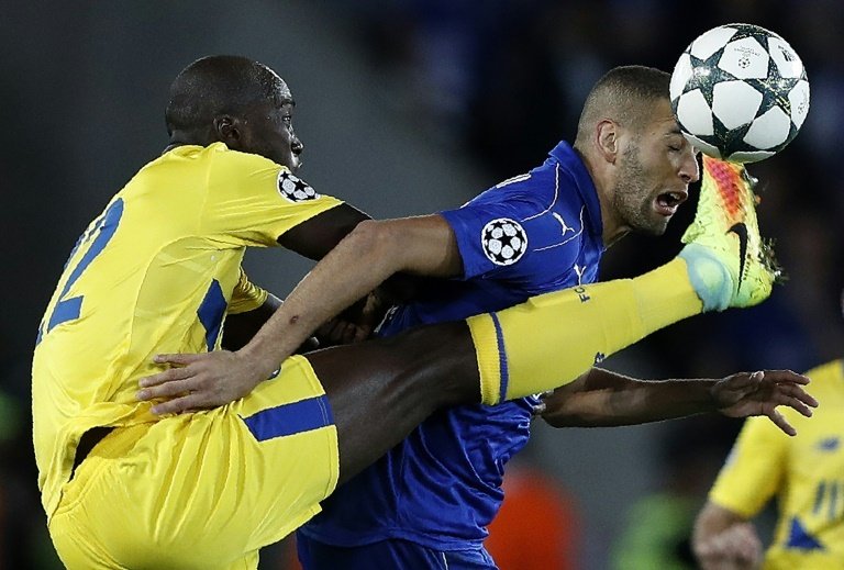 Porto's Danilo (L) vies with Leicester's Slimani during their UEFA Champions League match. AFP