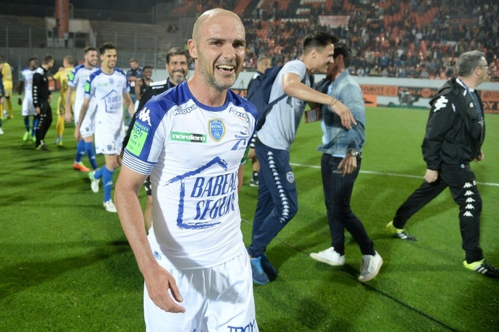 Troyes midfielder Benjamin Nivet celebrates at the end of the play-off match against Lorient