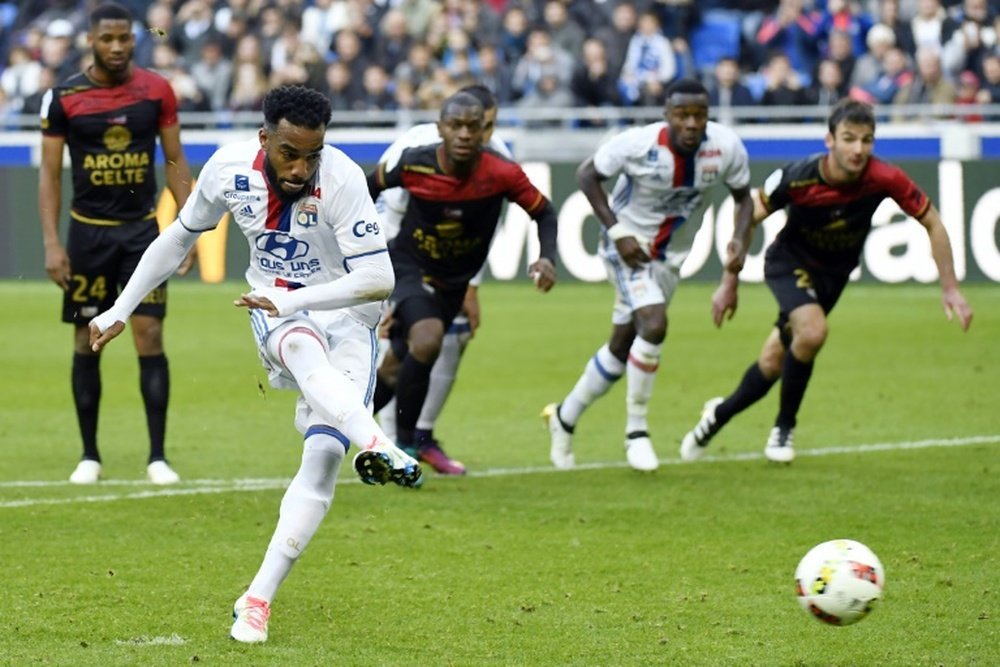 Lyon forward Alexandre Lacazette shoots a penalty and scores. AFP