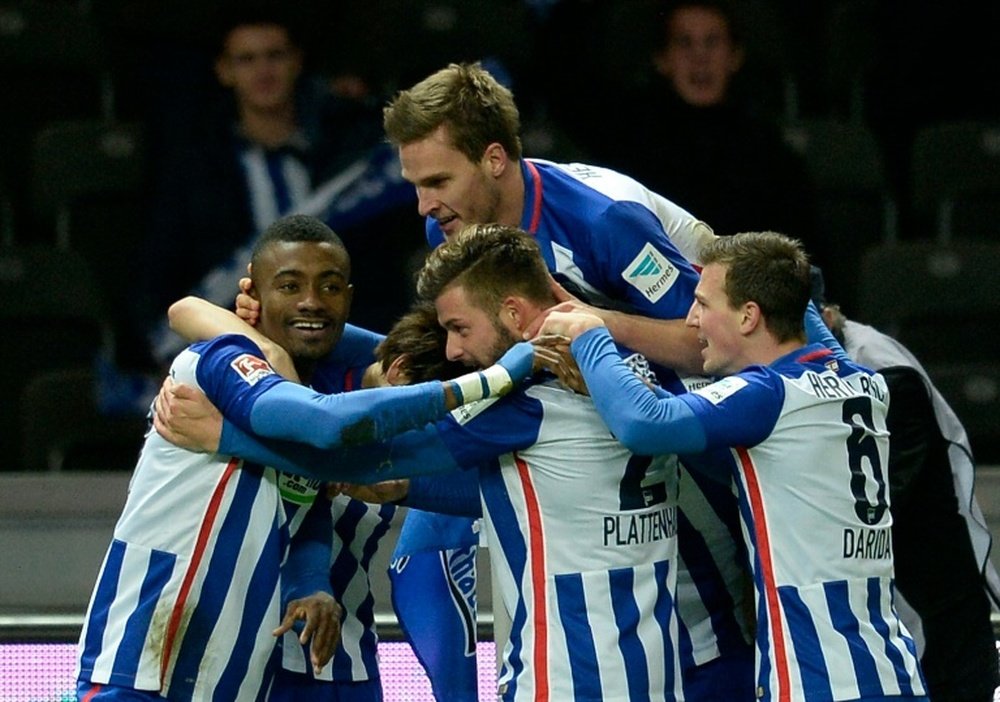 Herthas forward Salomon Kalou (L) celebrates with his teammates (from L) Genki Haraguchi, Sebastian Langkamp, Marvin Plattenhardt and Vladimir Darida after scoring during a Bundesliga football match against Mainz on December 20, 2015