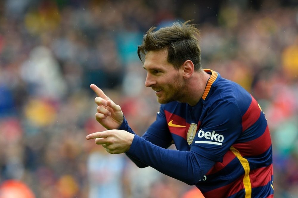 Barcelonas forward Lionel Messi celebrates after scoring a goal during the Spanish league football match FC Barcelona vs RCD Espanyol at the Camp Nou stadium in Barcelona on May 8, 2016