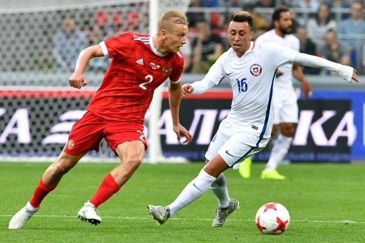 Russia rally for a 1-1 draw with Chile in football