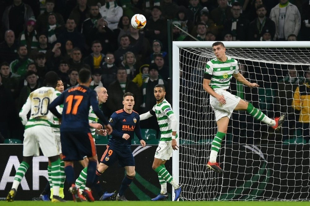 Lille would like to buy Simunovic (R) off Celtic. AFP