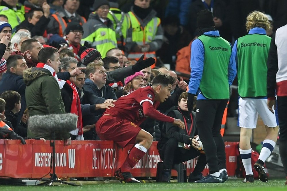 Firmino and Holgate exchanged words during an FA Cup tie in January. AFP