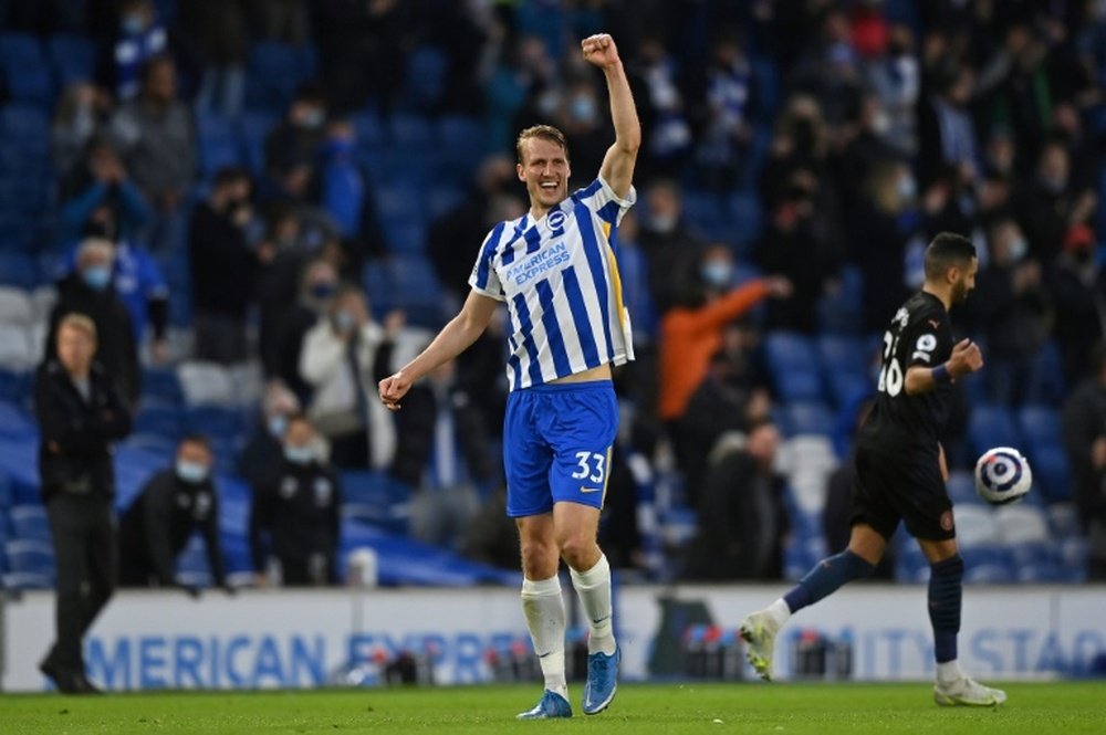 Dan Burn rounded off Brighton's remarkable comeback against City. AFP