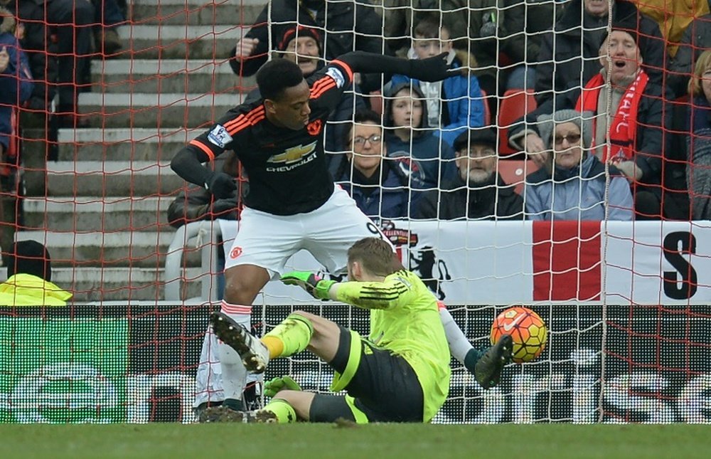Manchester United goalkeeper David de Gea (in yellow) accidentally knocks in a shot from Sunderlands Lamine Kone (not pictured)